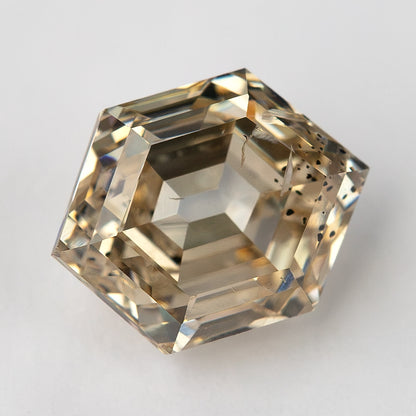 Angled face-up view showing the warm champagne tone and broad reflections