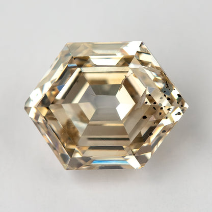 Close-up of the hexagonal step-cut diamond showing natural inclusions