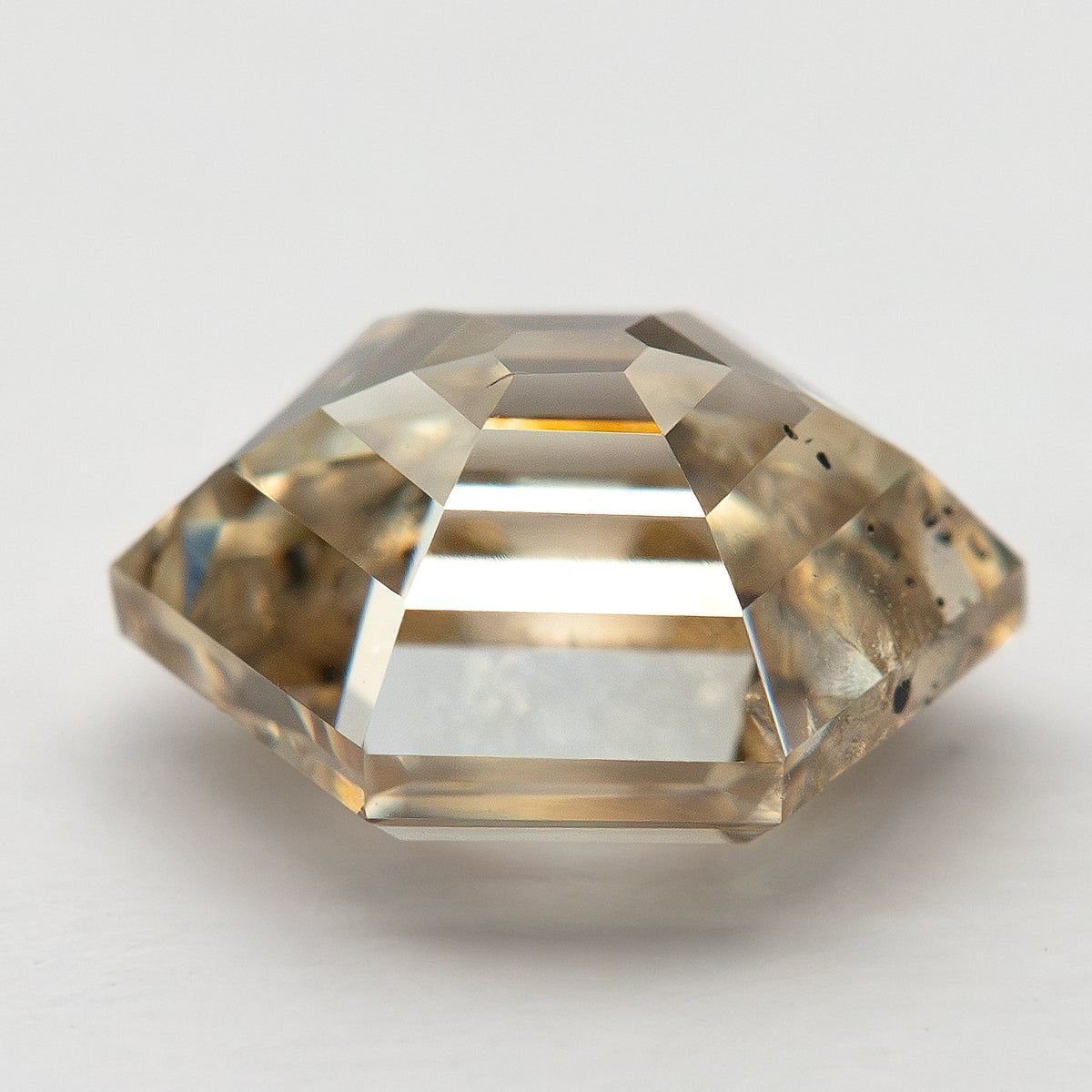 Side profile of the natural hexagonal step-cut diamond showing its pavilion