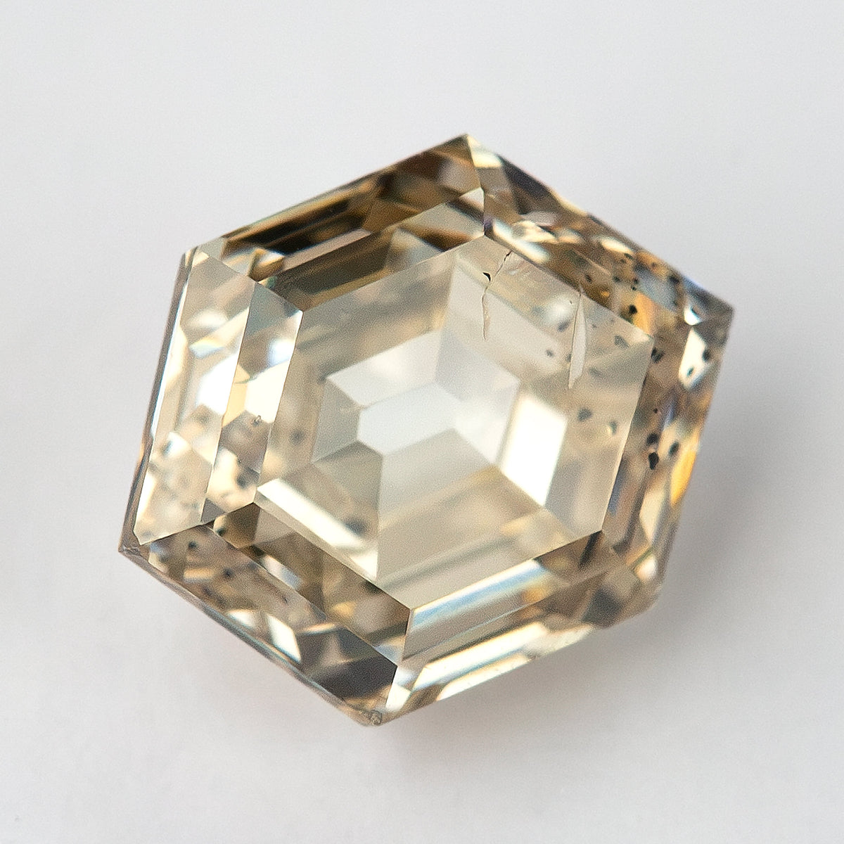 Antique-inspired angled view of the natural champagne hexagon diamond