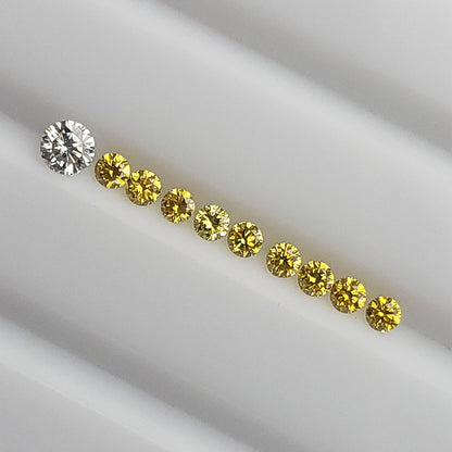 Yellow diamonds in a diagonal face-up line beside an excluded white comparison diamond.