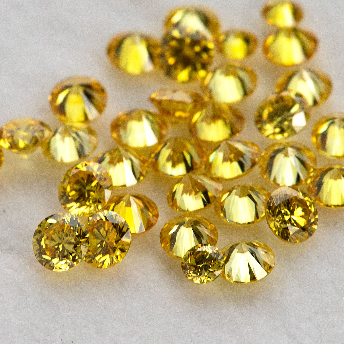Mixed-angle macro cluster of yellow diamonds with an excluded white comparison diamond.