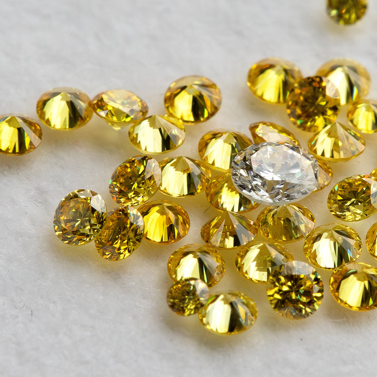 Close angled yellow diamond cluster surrounding a white comparison diamond, not included.