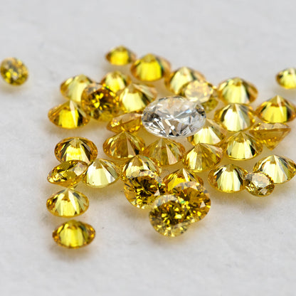 Low-angle yellow diamonds showing side facets beside an excluded white comparison diamond.