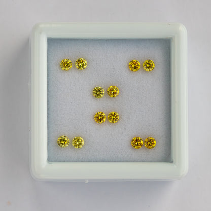 Overhead white-tray view of the six yellow diamond pairs.