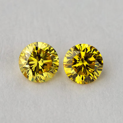 Macro close-up of the exact matched canary yellow round brilliant diamond pair