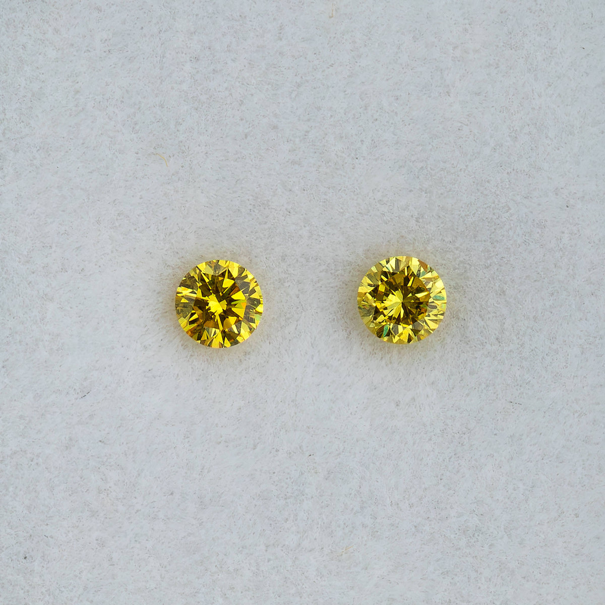 Second face-up view of the exact untreated yellow diamond pair
