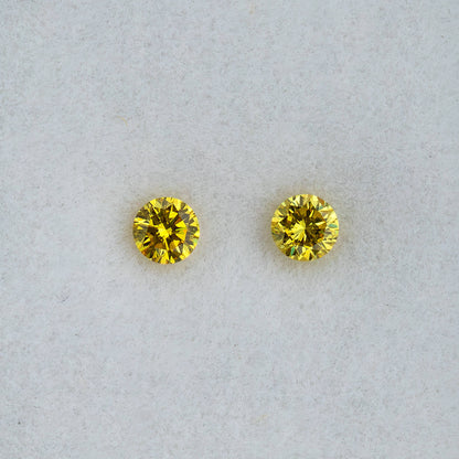 Second face-up view of the exact untreated yellow diamond pair
