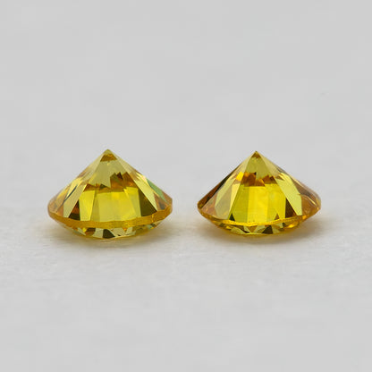 Side-profile view showing the matched yellow diamonds' depth and faceting
