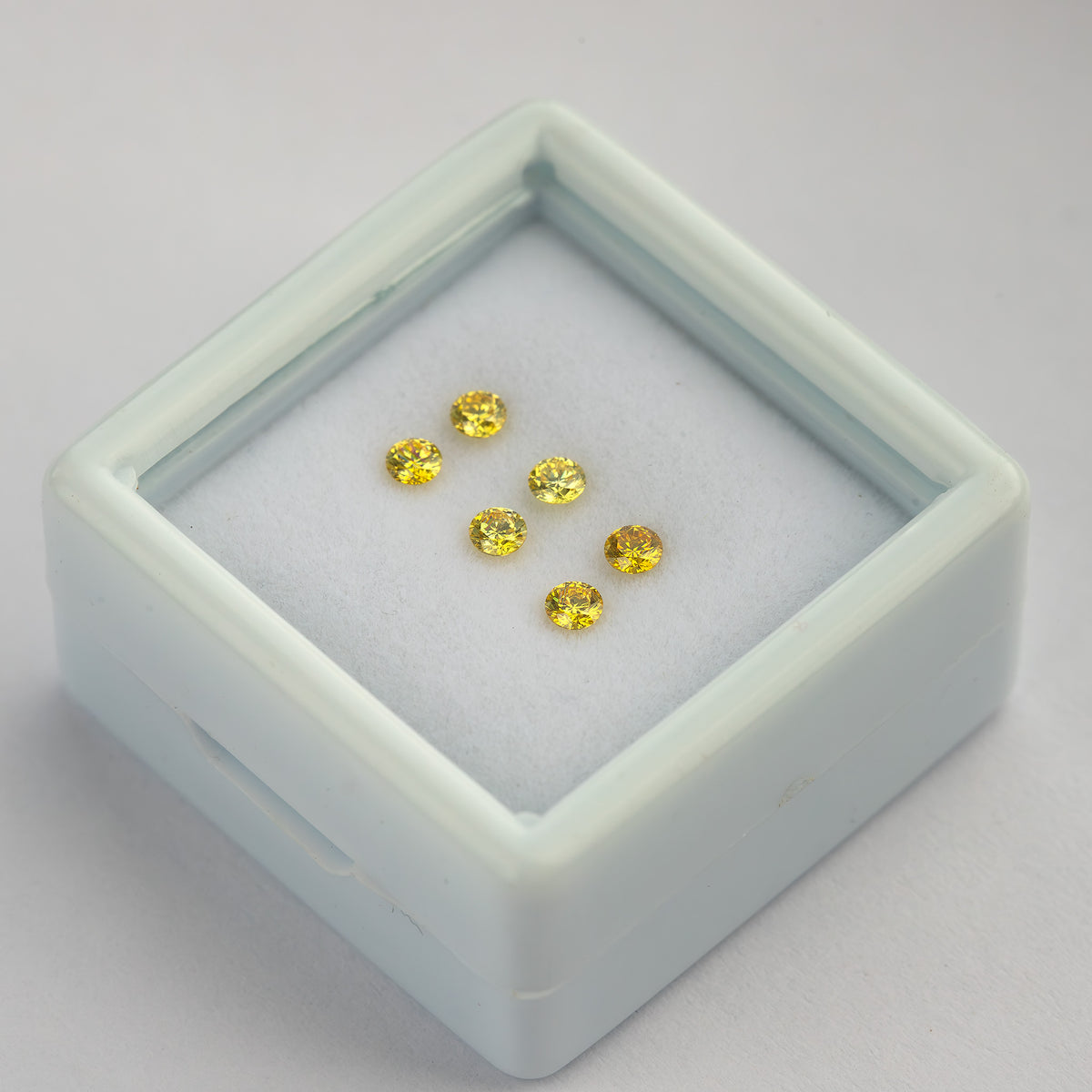 Raised diagonal tray showing the yellow pairs and depth of the display box.