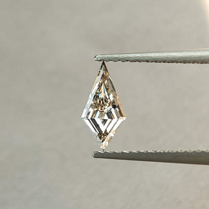 Face-up angle of the elongated kite lab-grown diamond showing dark central contrast and bright geometric facet reflections.