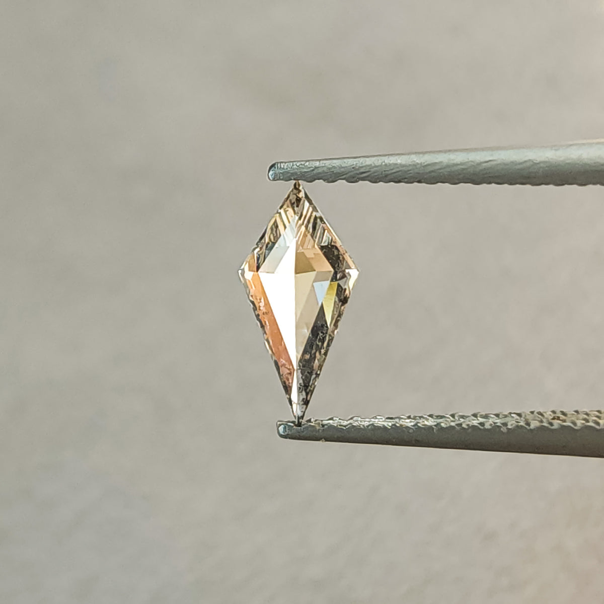 Back and pavilion view of the elongated kite lab-grown diamond, showing its pointed outline and geometric pavilion facet pattern.