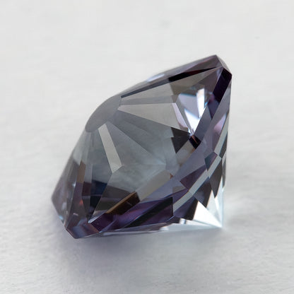 Oblique depth view of the pentagon lab-grown sapphire leaning on a light surface.
