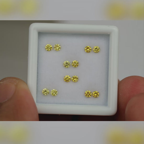 Natural canary yellow diamonds shown in motion; purchase contains only the selected pair or individual diamond.