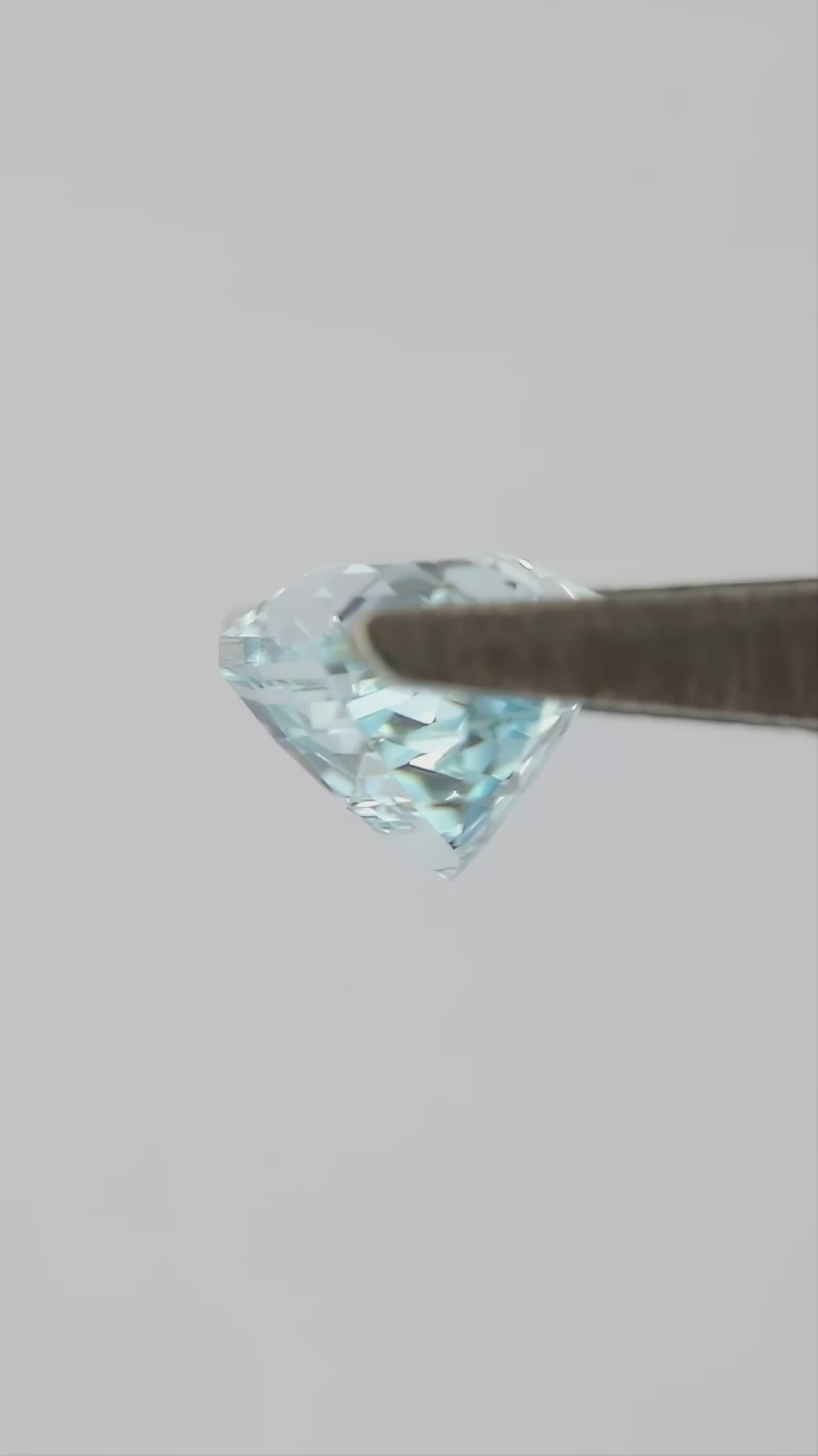 Video showing the representative aquamarine-blue lab-grown sapphire through changing viewing angles.