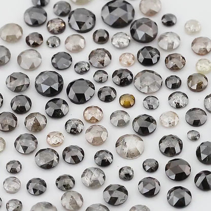 Moving views of the mixed grey and black rose-cut source parcel; random scoop contents vary.