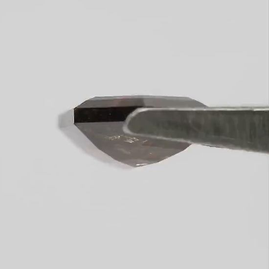 Side-profile video of H279 in tweezers, showing its shallow form and double-sided faceting.