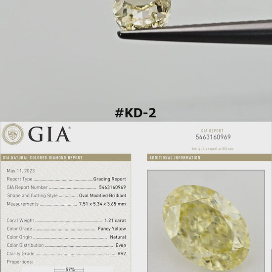 Portrait-format video: The yellow oval diamond turns in tweezers and rests against fingertips for scale, alongside its GIA report details.