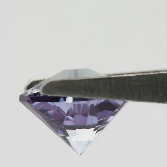 Hanami-cut lab-grown sapphire shown from pavilion and profile angles, followed by finger-held face-up views for scale.
