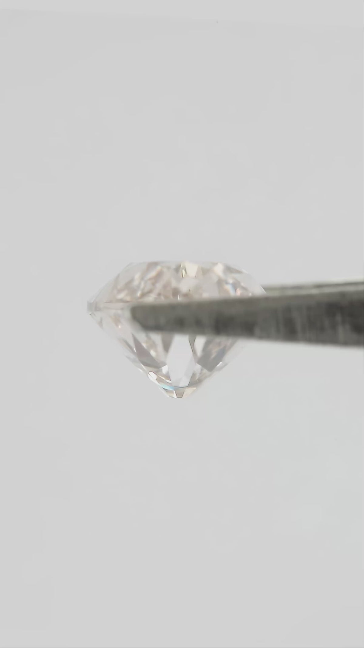 2.44 ct Light Champagne Lab-Grown Diamond, Old Mine Moval Cut, BLD124, movement video 2 showing the loose stone's faceting and color response.