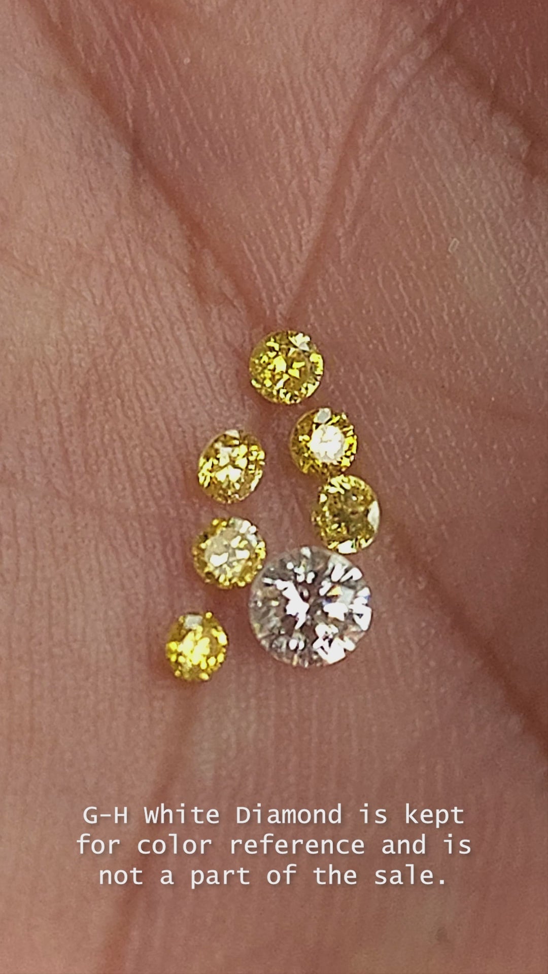 Six natural canary yellow diamonds in motion; the white comparison diamond is excluded.