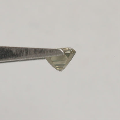 Emerald-cut diamond rotating in tweezers from crown to reverse views, followed by horizontal fingertip views showing its scale.