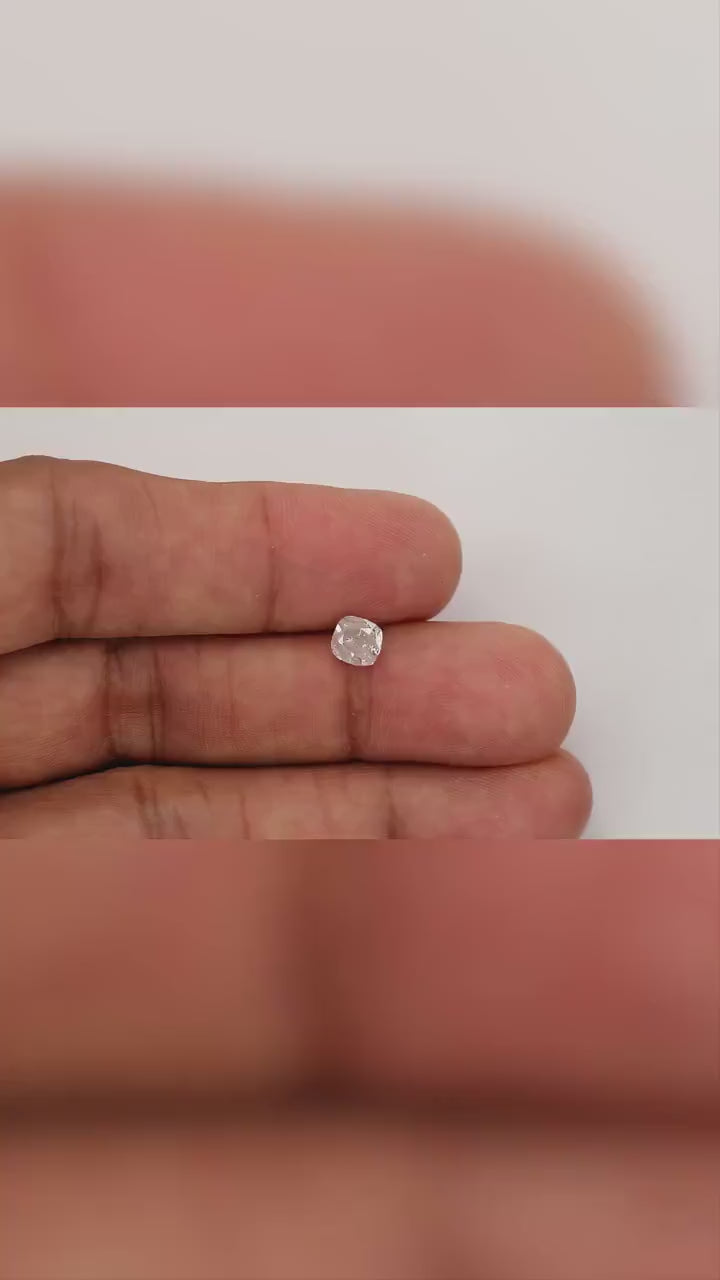 Video of the exact 1.02 ct natural light pink cushion diamond rotating on fingertips for relative size and color.