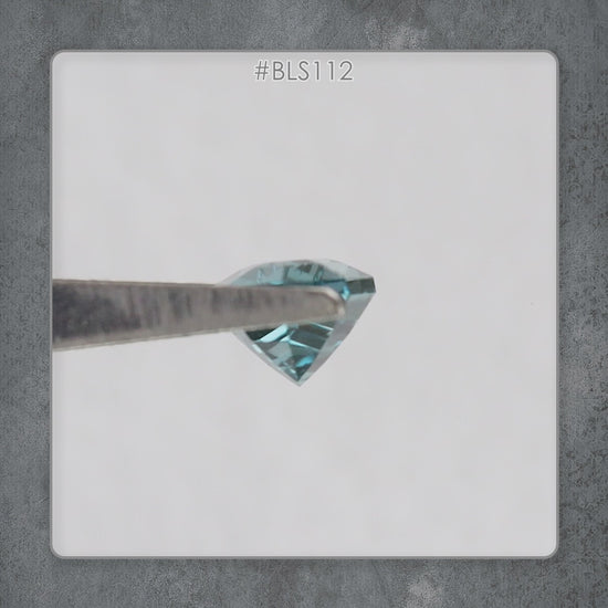 Video showing the BLS114 teal lab-grown sapphire faceting and color response in motion.
