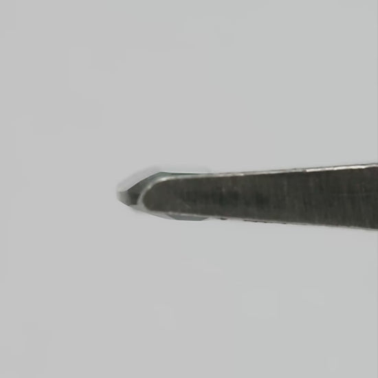 Natural-light rotation and fingertip-scale video of the exact green-blue portrait-cut sapphire.