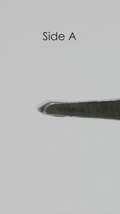 Natural-light rotation and fingertip-scale video of the exact green-blue portrait-cut sapphire.