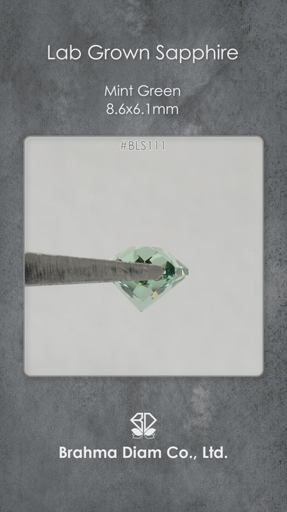 Video of BLS111 mint green lab-grown sapphire in tweezers, showing its facets and reflections as the viewing angle changes.