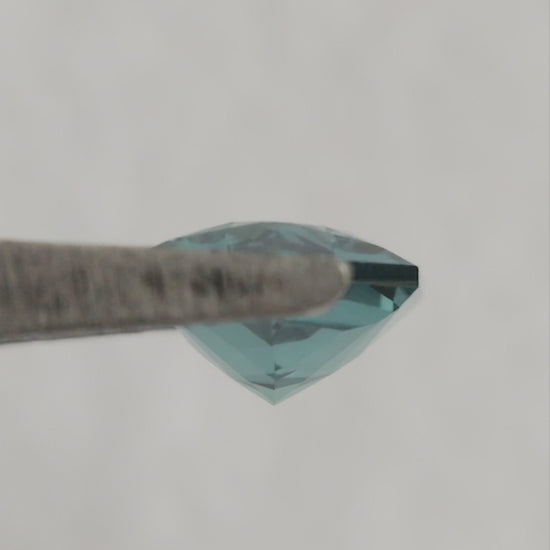 Video of BLS115 lab-grown sapphire showing its facets and blue-green reflections as the viewing angle changes.