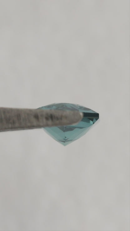 Video of BLS115 lab-grown sapphire showing its facets and blue-green reflections as the viewing angle changes.