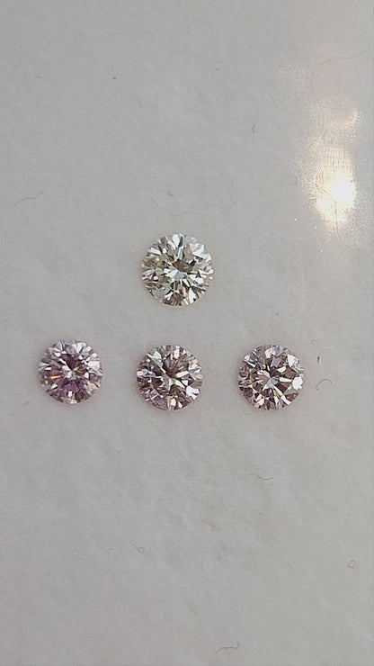 Finished natural-light video of pink round diamond samples with white color references; the group is not the purchase unit.