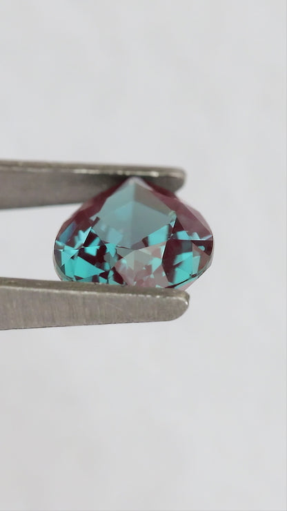 Merchant-finished natural-light video of the pear lab-grown alexandrite design, including crown, back and fingertip-scale views.