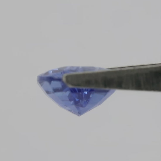 4K natural-daylight video of the exact 1.86 ct violetish blue pear mixed-cut sapphire, showing its face-up color, outline and facet reflections in motion.