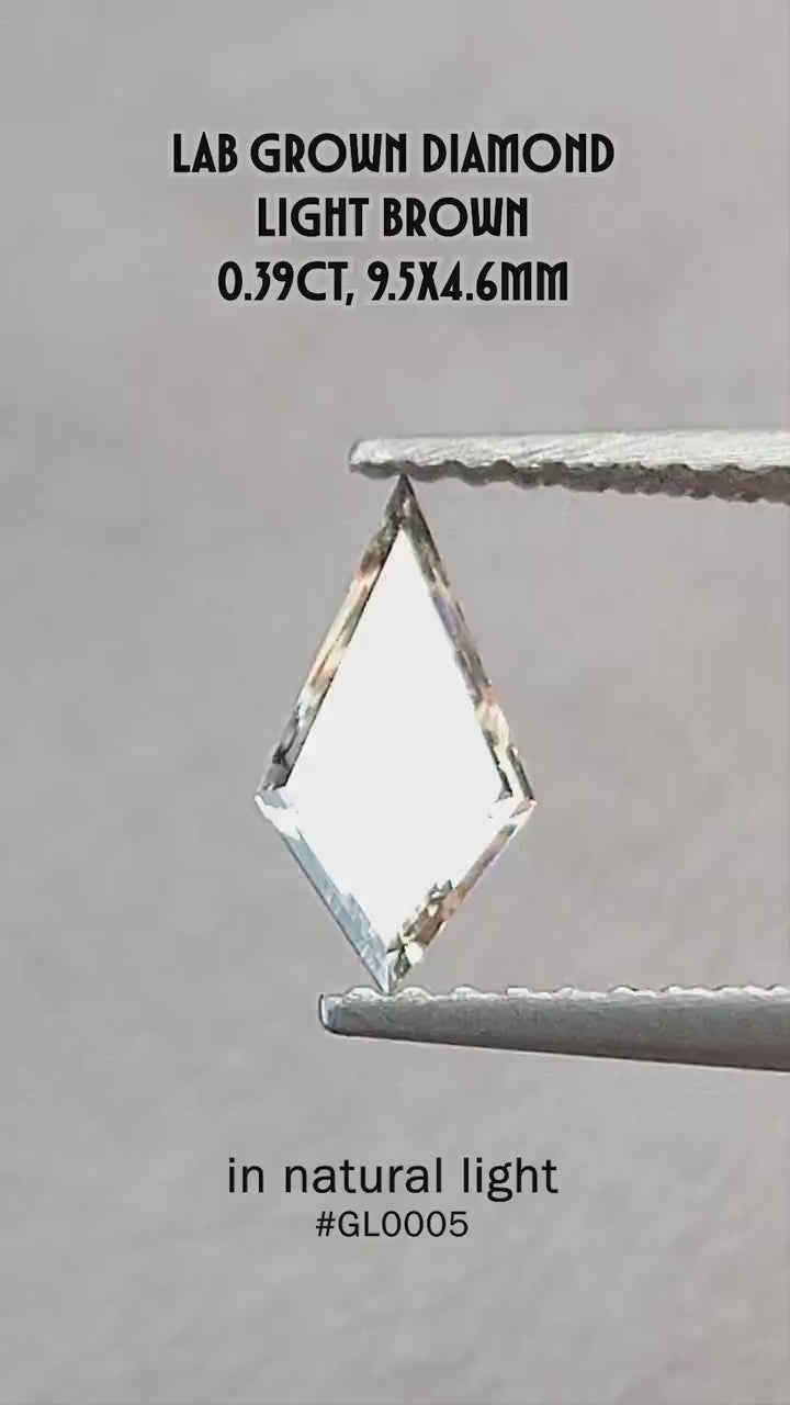 Video of the exact 0.39 ct light champagne elongated kite lab-grown diamond showing its step-cut reflections in motion.