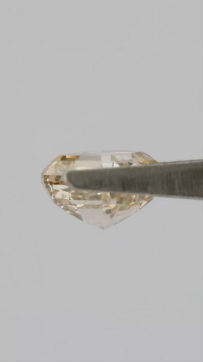 Champagne Asscher-cut diamond shown in tweezers from profile and pavilion angles, followed by finger-held face-up views.
