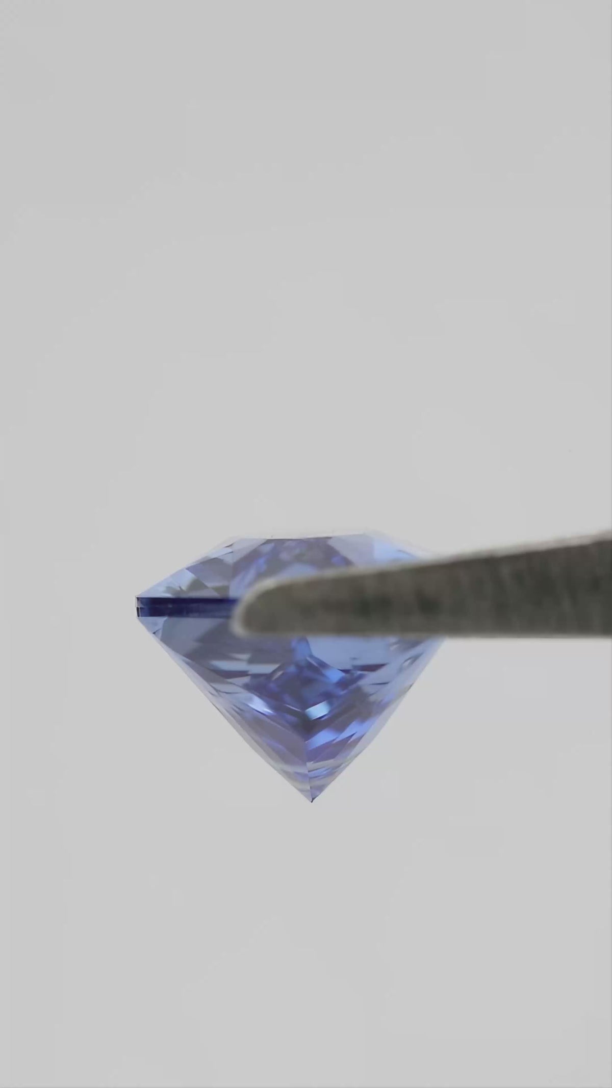 12 x 6 mm Royal Blue Lab-Grown Sapphire, BLS126 Brilliant Cut, movement video 2 showing the loose stone's faceting and color response.